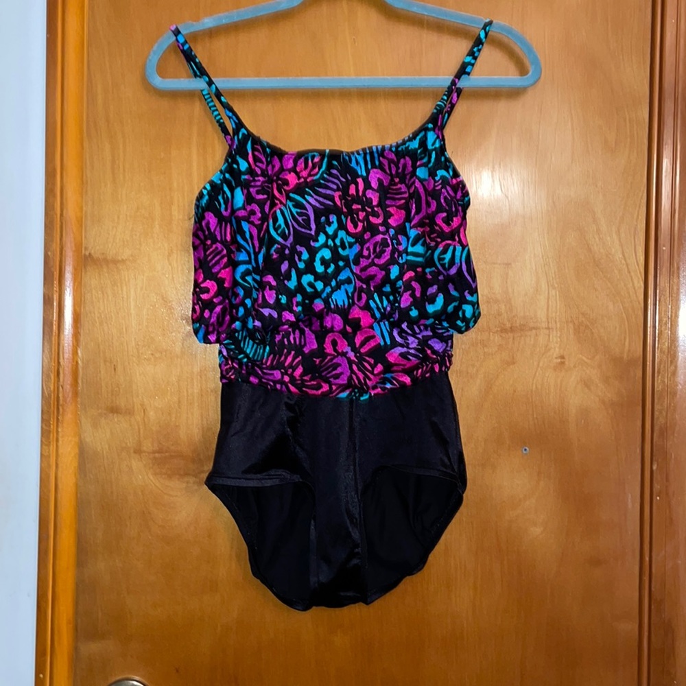 One piece bathing suit. Top multicolored print with waist for a blousey look